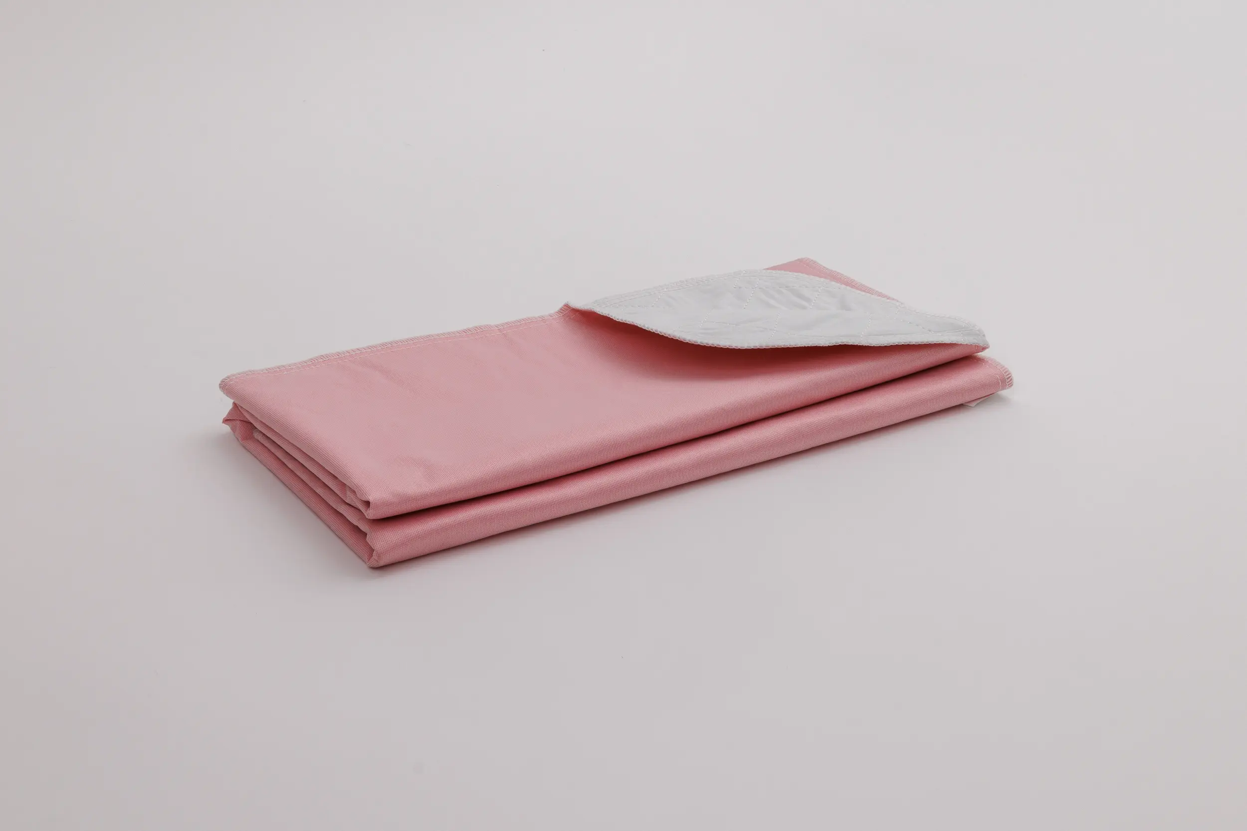 WaveUP - Incontinence Pad - 50% Cotton / 50% Polyester Face - 95% Polyester / 5% Rayon Soaker - 100% Polyester Barrier - 34" x 36", White, Pink